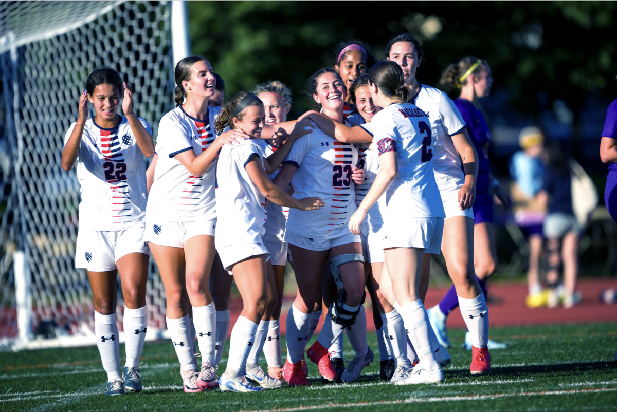 The Scots celebrate a goal against Northwestern. 